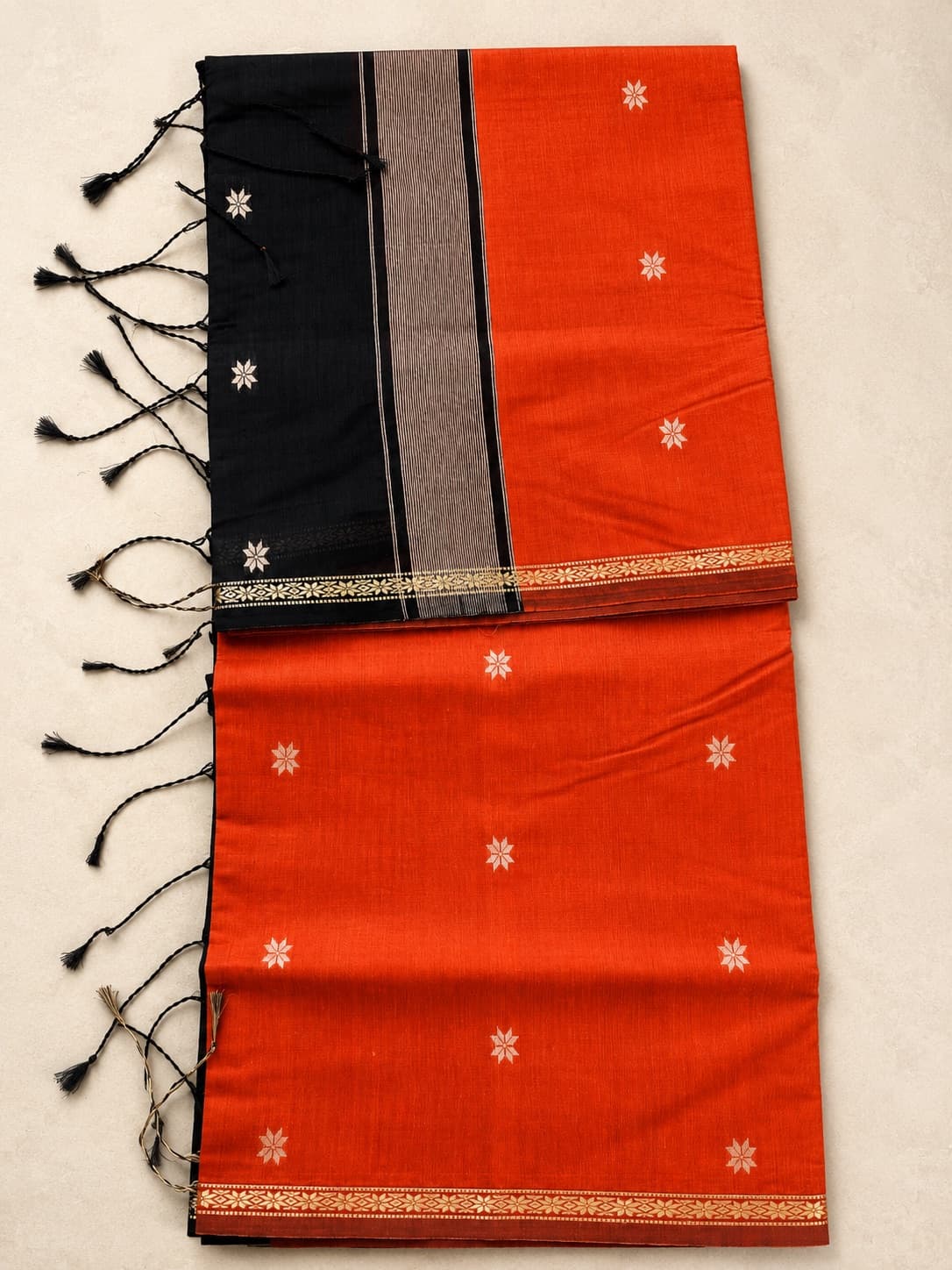 Orange And Black Cotton Saree With Floral Motifs